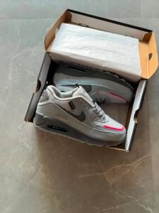 wolf grey low-top sneakers with black detailing and pink-red accents