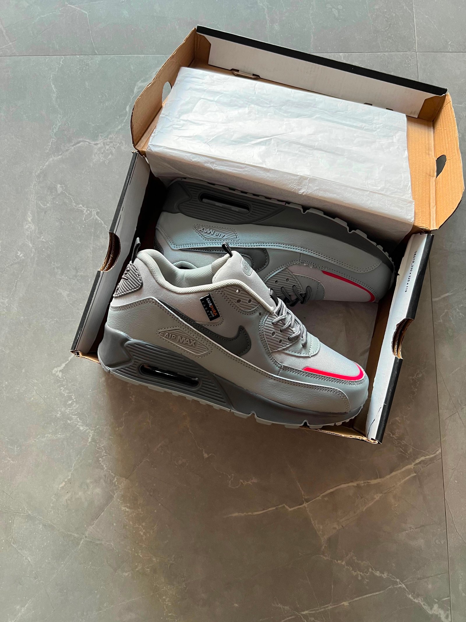 wolf grey low-top sneakers with black detailing and pink-red accents