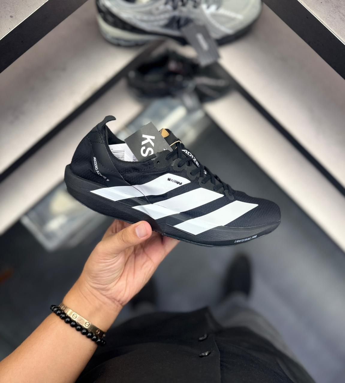 Adizero Adios 9 Black Speed Racing Shoes (2) Adizero Adios 9 Black Speed Racing Shoes (2)