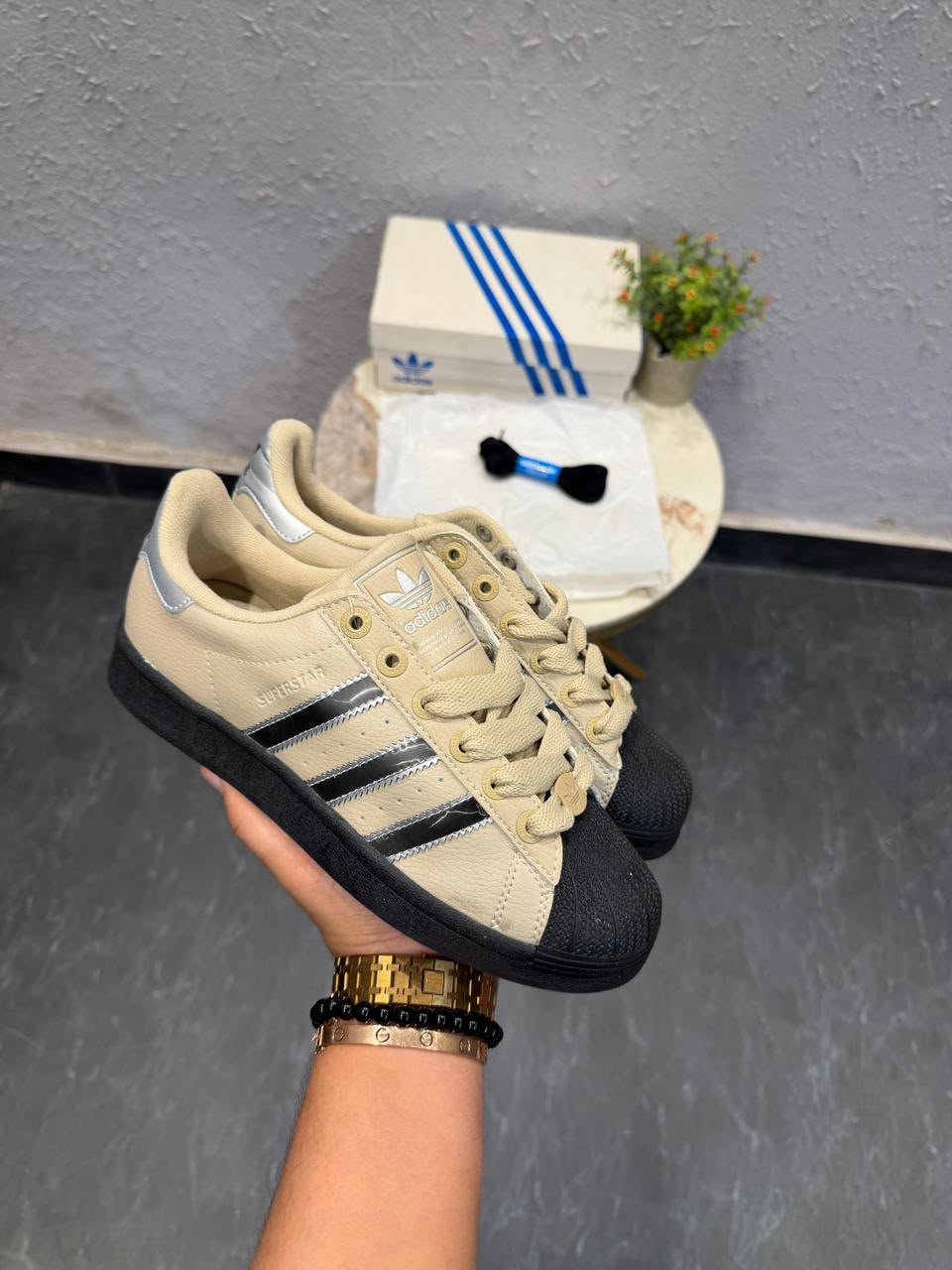 Beige Black Silver Classic Shell-Toe Sneakers – Retro Streetwear Edition (2) Beige black and silver shell-toe sneakers with metallic side stripes and black outsole