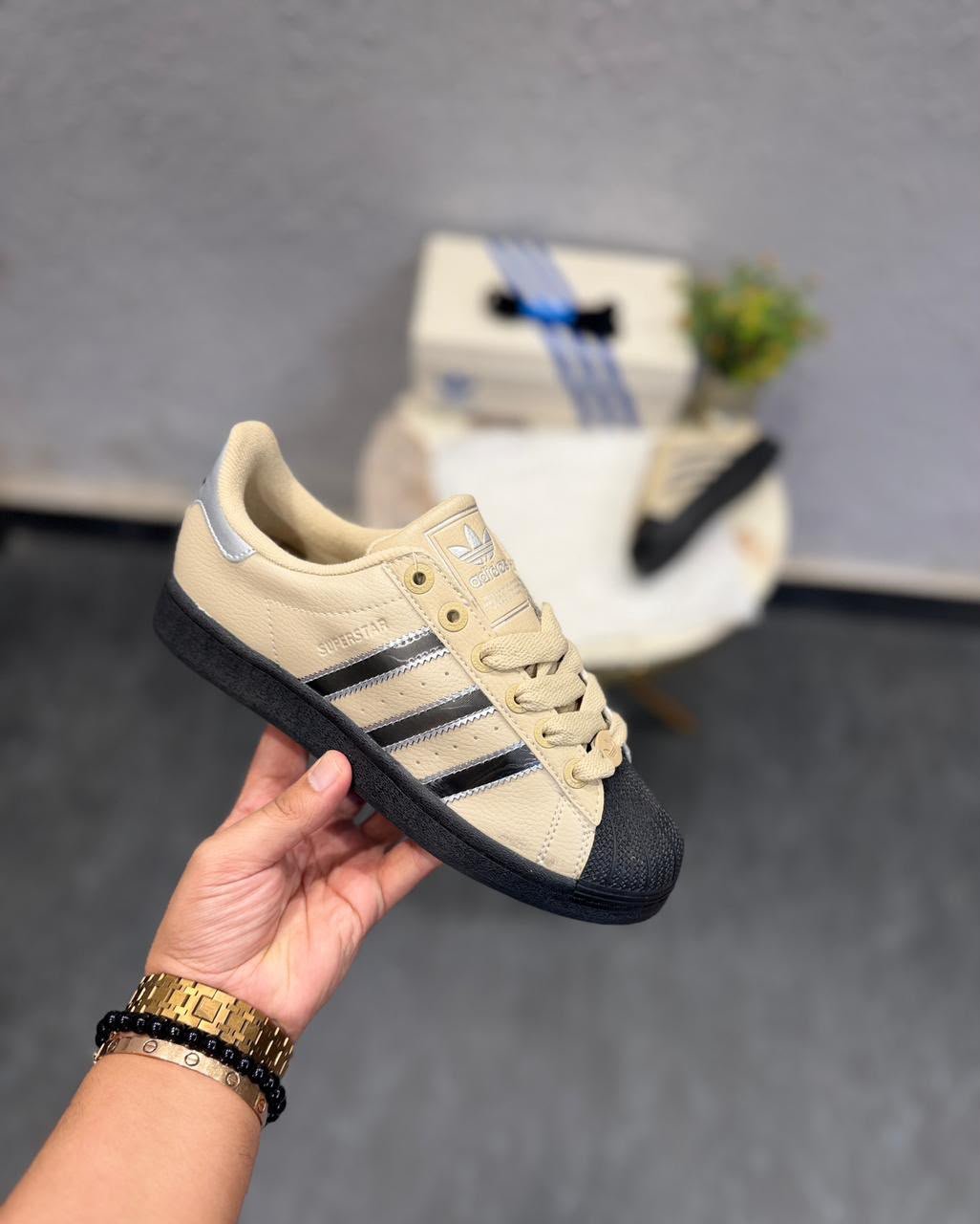 Beige Black Silver Classic Shell-Toe Sneakers – Retro Streetwear Edition (3) Beige black and silver shell-toe sneakers with metallic side stripes and black outsole