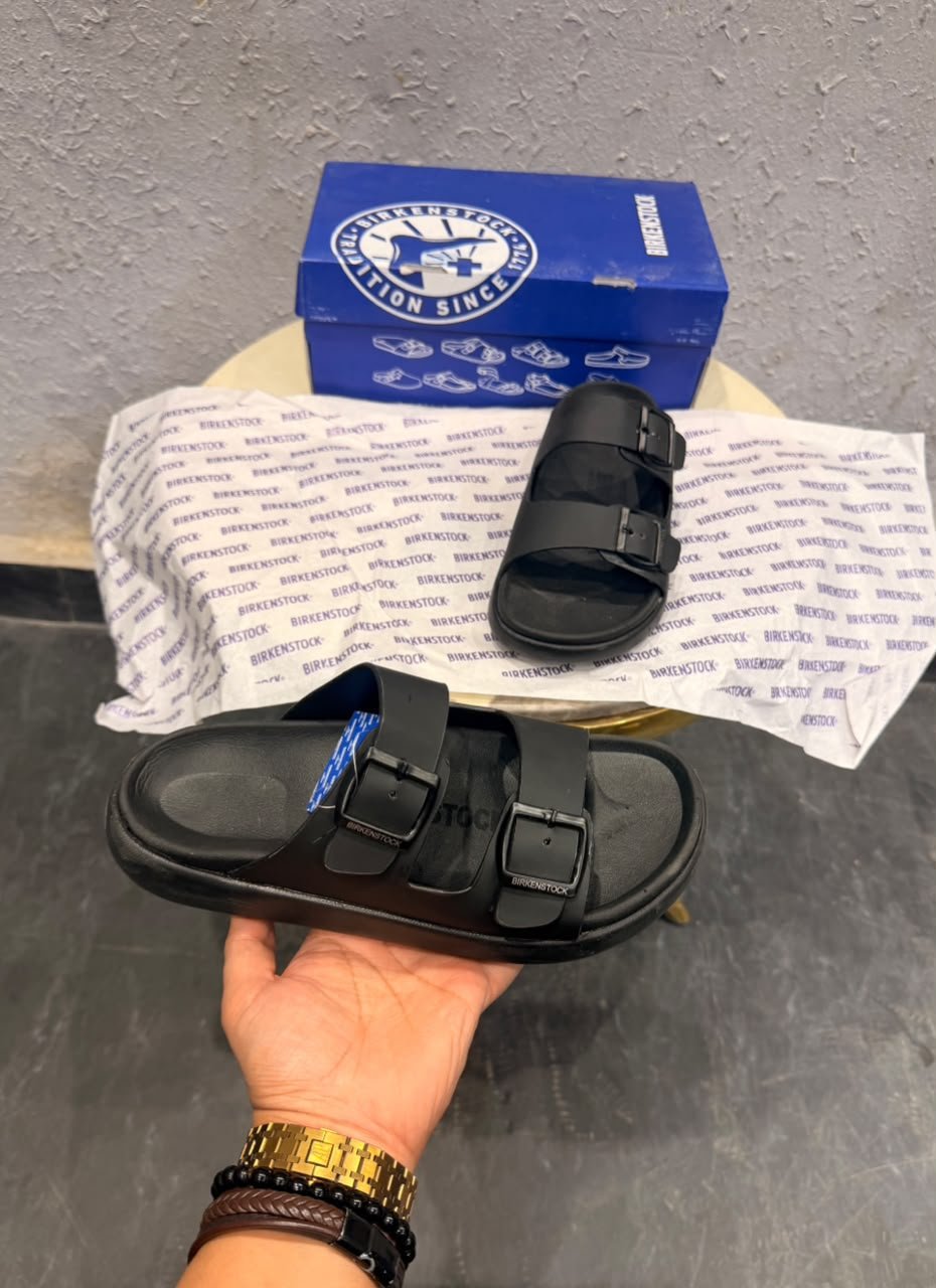 Black Double-Buckle Comfort Slides for Men – Minimalist Casual Sandals (2) Black double-buckle slides for men with a contoured footbed and minimalist slip-on design