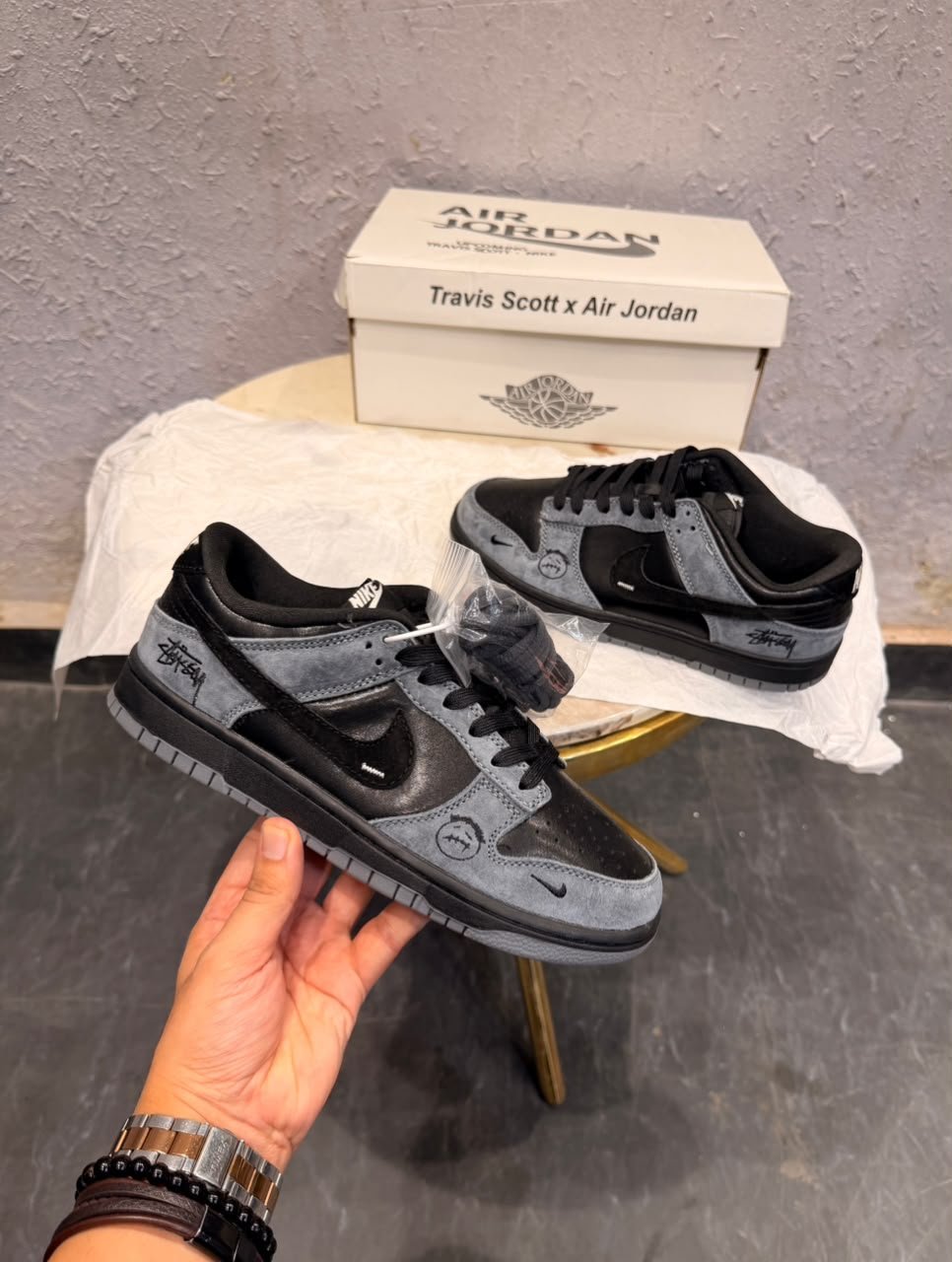 Black Grey Sneakers – Retro Streetwear Edition (2) Black and charcoal grey low-top sneakers with layered panels, a perforated toe, grey outsole, and additional black laces.