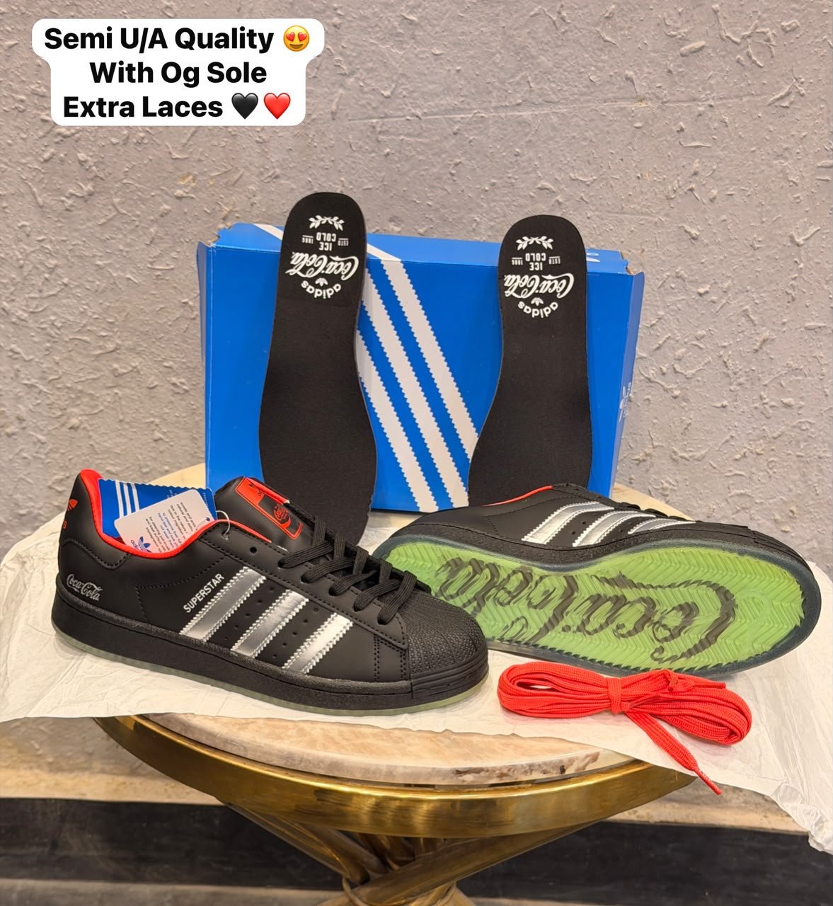 Black Retro Sneakers – Red Accent Shell-Toe Streetwear Edition (4) Black retro low-top sneakers with silver-toned stripes, red accents, a textured shell-shaped toe, and a green-toned outsole