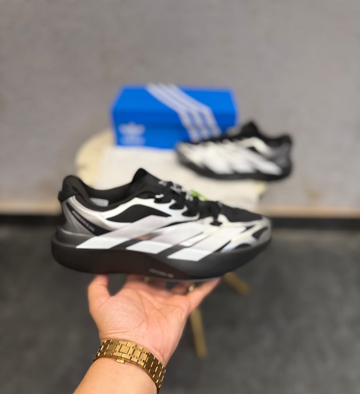 Black Silver Running Sneakers – Performance-Inspired Streetwear Edition (4) Black and silver low-top sneakers with white side stripes, perforated detailing, and a sculpted dark outsole