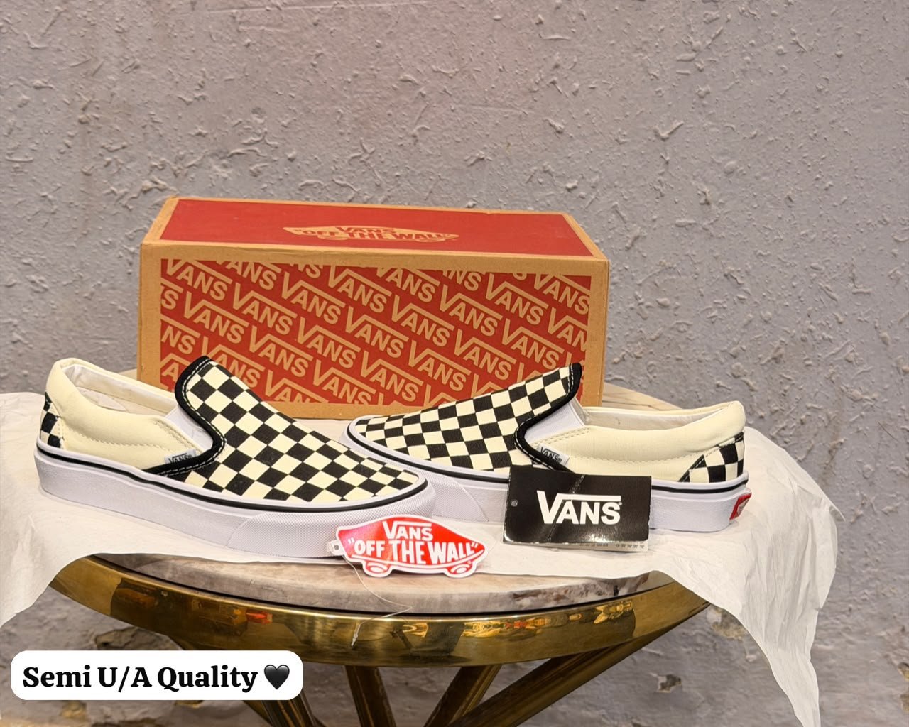 Black and Cream Checkerboard Slip-On Sneakers – Classic Casual Style (1) Black and cream checkerboard slip-on sneakers with a low-top silhouette and white sole