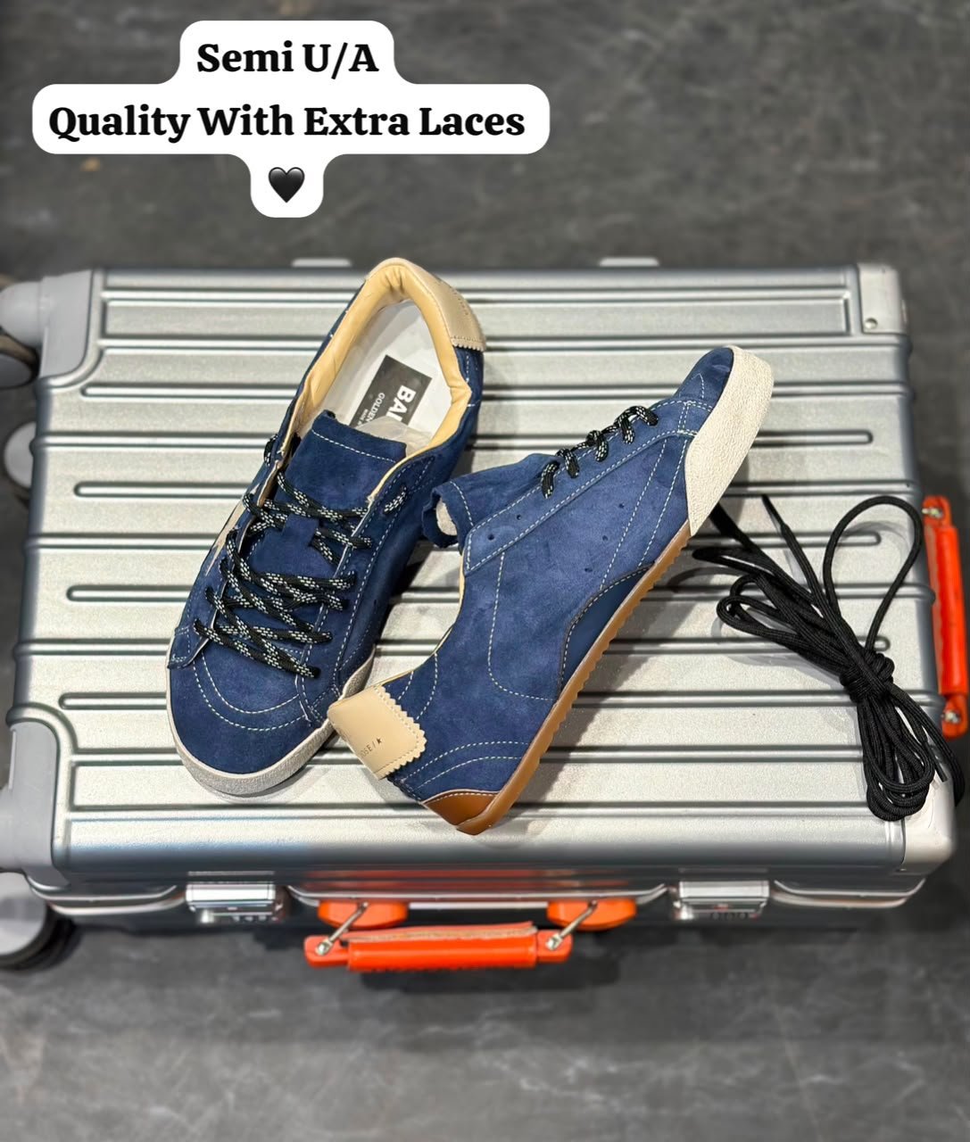 Blue denim-style sneakers with a cream star detail, lace-up fastening, and gum-style outsole