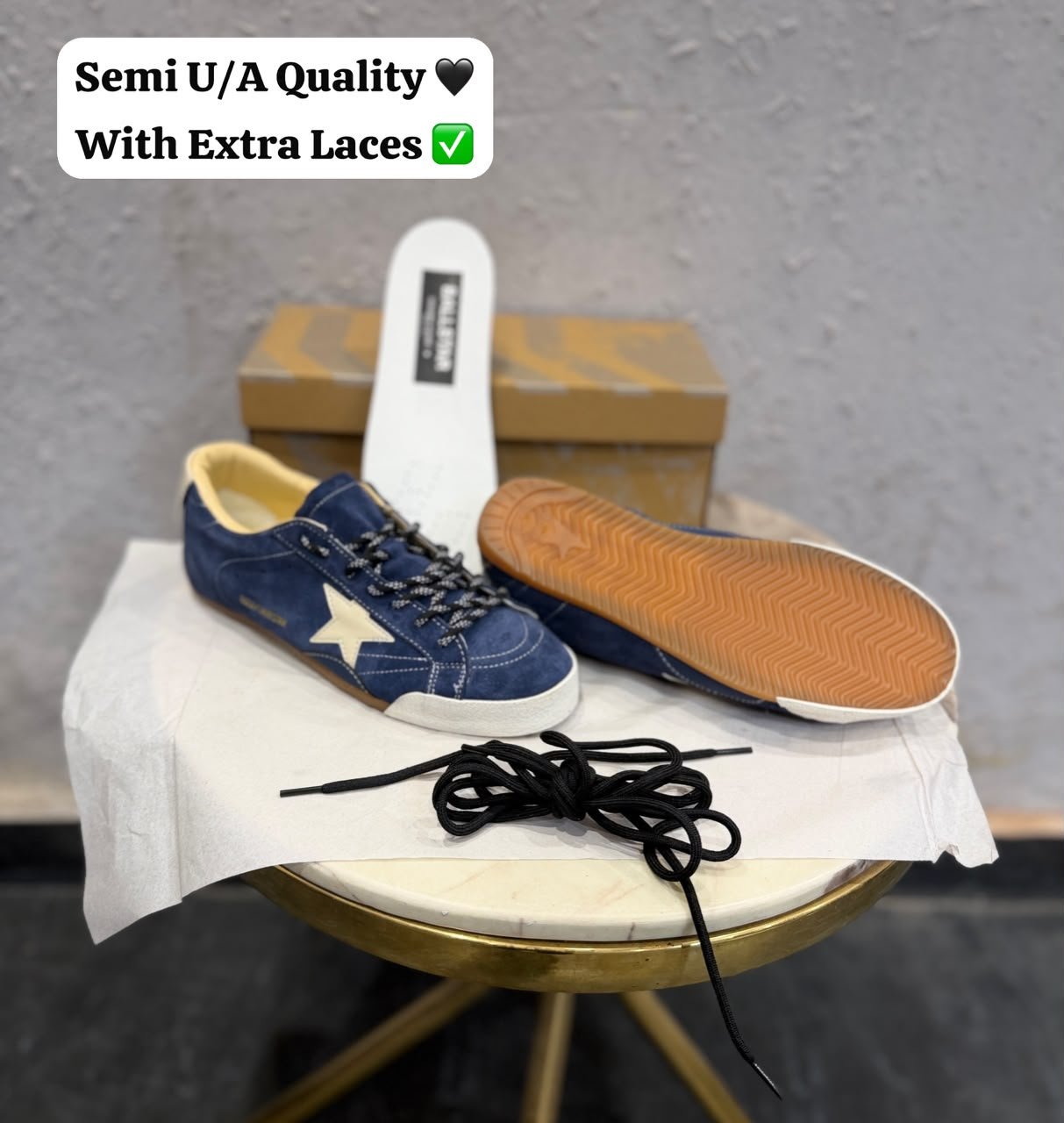 Blue denim-style sneakers with a cream star detail, lace-up fastening, and gum-style outsole