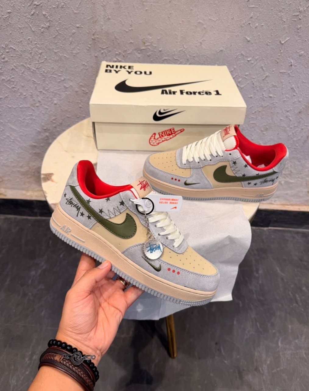 Grey Red Olive Sneakers – Custom Retro Street Style (3) Grey low-top sneakers with olive-green accents, red lining, cream toe panels, decorative star graphics, and a grey circular-patterned outsole