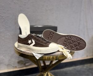 One Star Player 76 retro low-top sneakers in black, brown, and white green colourways with star emblems and contrasting soles