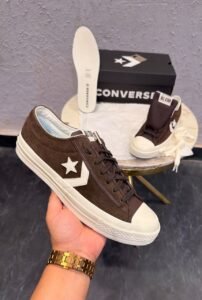 One Star Player 76 retro low-top sneakers in black, brown, and white green colourways with star emblems and contrasting soles