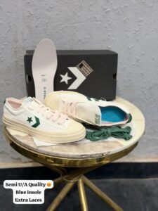 One Star Player 76 retro low-top sneakers in black, brown, and white green colourways with star emblems and contrasting soles