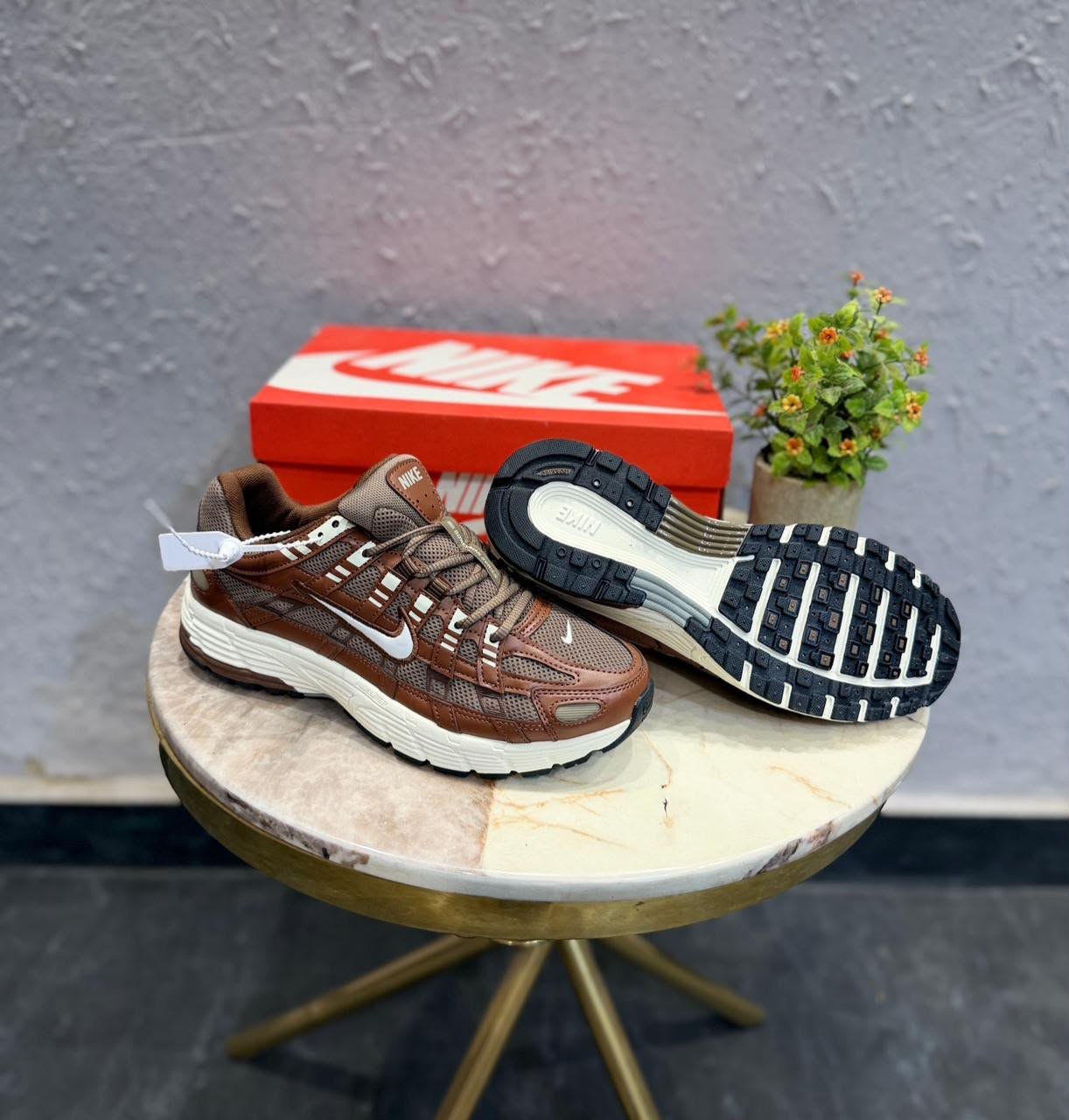 Brown and white P-6000 running-inspired sneakers with layered mesh-style panels and a cream-coloured sole