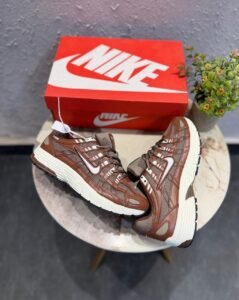 Brown and white P-6000 running-inspired sneakers with layered mesh-style panels and a cream-coloured sole