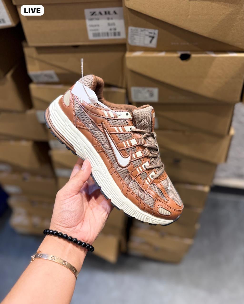 Brown and white P-6000 running-inspired sneakers with layered mesh-style panels and a cream-coloured sole