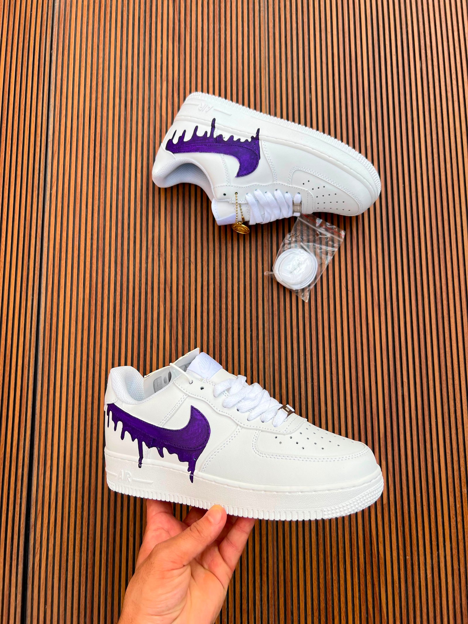 White Custom Sneakers – Multicolour Drip Art Edition (4) White custom low-top sneakers featuring colourful drip-art graphics in pink, blue, yellow, and purple