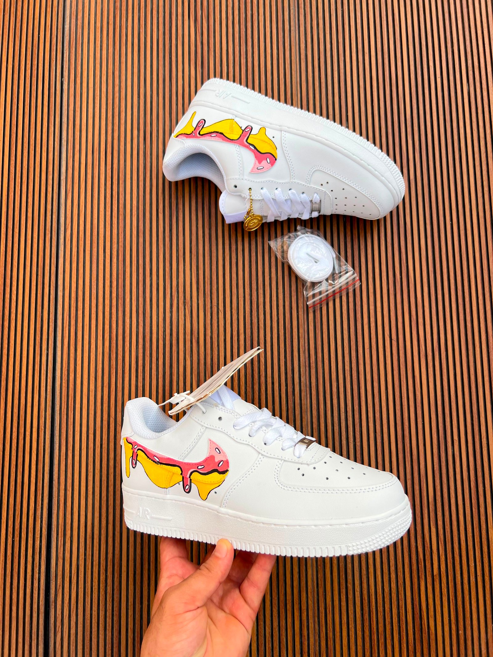 White Custom Sneakers – Multicolour Drip Art Edition (7) White custom low-top sneakers featuring colourful drip-art graphics in pink, blue, yellow, and purple