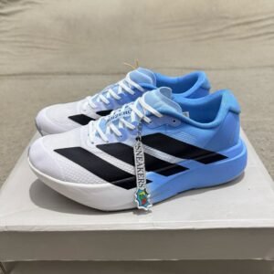 White and sky blue athletic-style sneakers with black side stripes, lace-up closure, and a sculpted white and blue sole