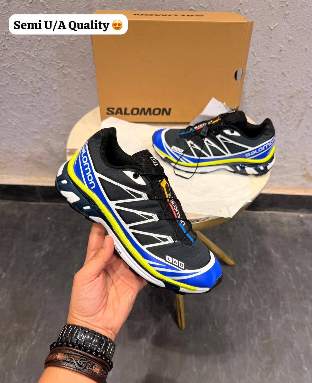 XT Ghost Waterproof Trail Sneakers – Black, Blue & Neon Yellow (2) Black blue and neon yellow XT Ghost trail-inspired sneakers with geometric overlays and rugged tread outsole